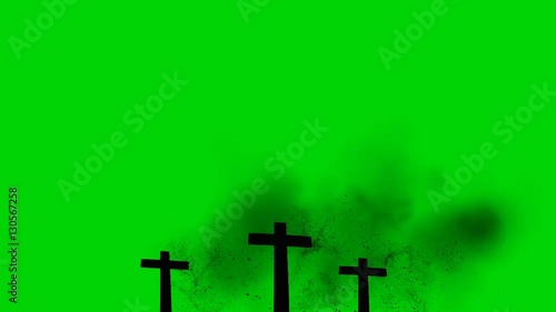 3 Wooden Crosses Burning On A Green Screen Background photo