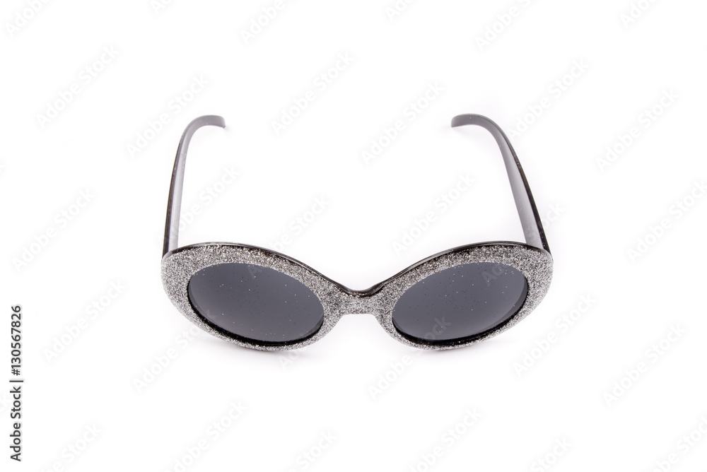 A pair of silver glasses with black lenses isolated on white background. Extravagant party goggles. Carnival accessory. Closeup. Front, top view. A pair of silver glasses with black lenses isolated on white background. Extravagant party goggles. Carnival accessory. Closeup. Front, top view.