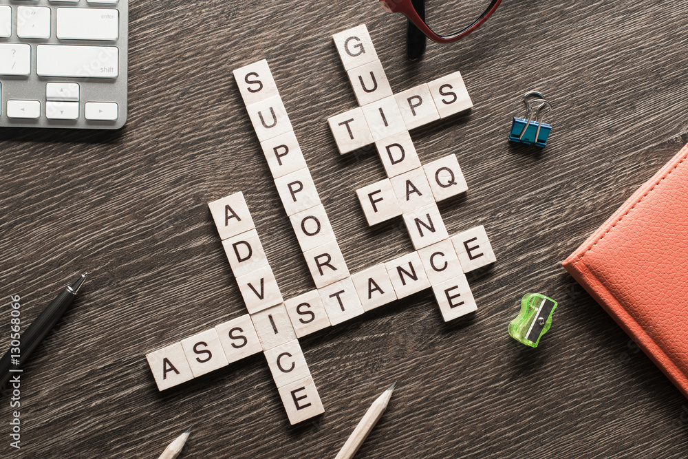 Feedback assistance support guidance words spelled with cubes on wooden table