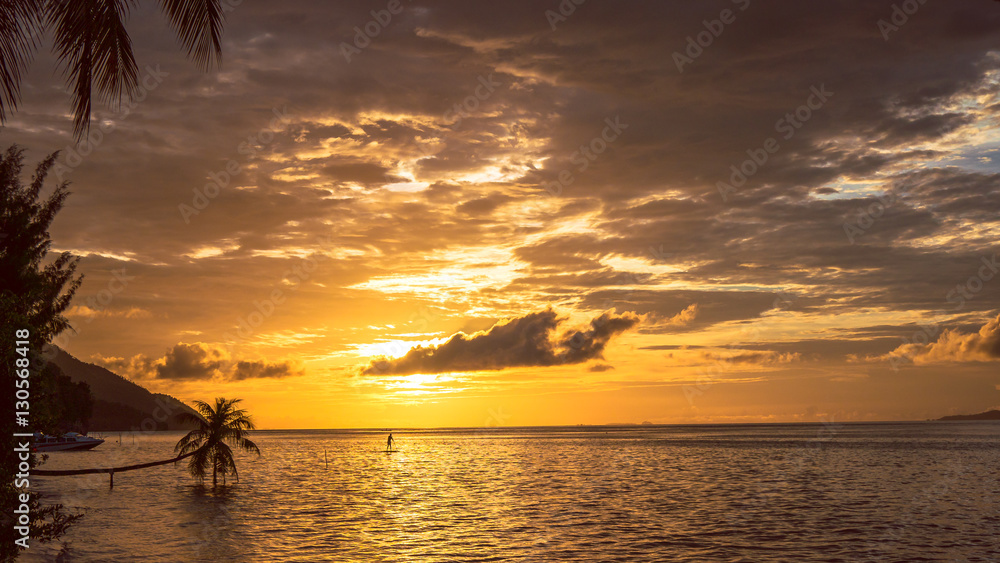 Obraz premium Stand up paddler SUP on Sunset, Kri Island. Raja Ampat, Indonesia, West Papua