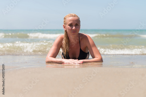 Woman Lying on the Sand the Ocean Coast