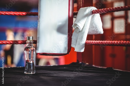 Water bottle and a towel in boxing ring