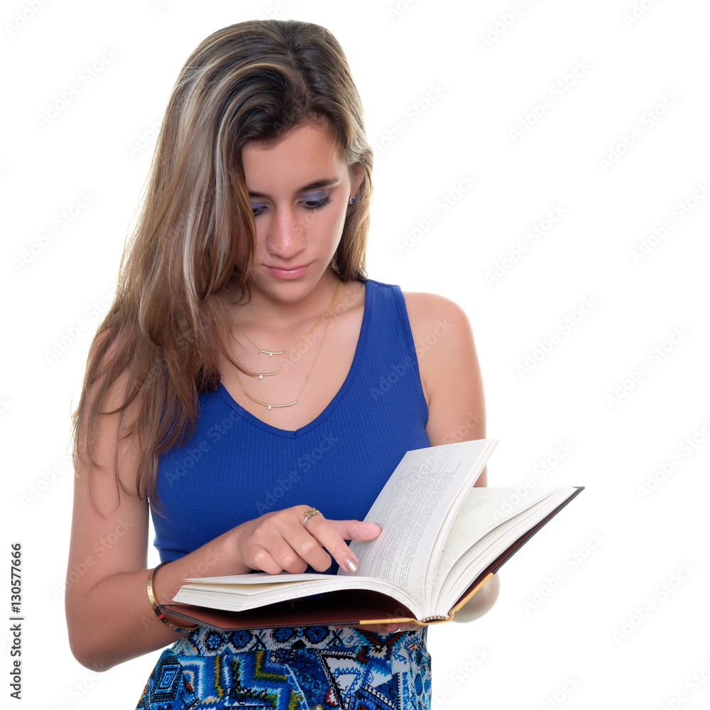 Pretty teenage girl reading a book isolated on white Pretty teenage girl reading a book isolated on white