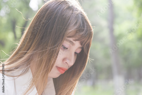 Sad girl closeup in summer