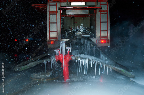 Fototapeta Naklejka Na Ścianę i Meble -  Fire-engine vehicle fire truck in heavy frost