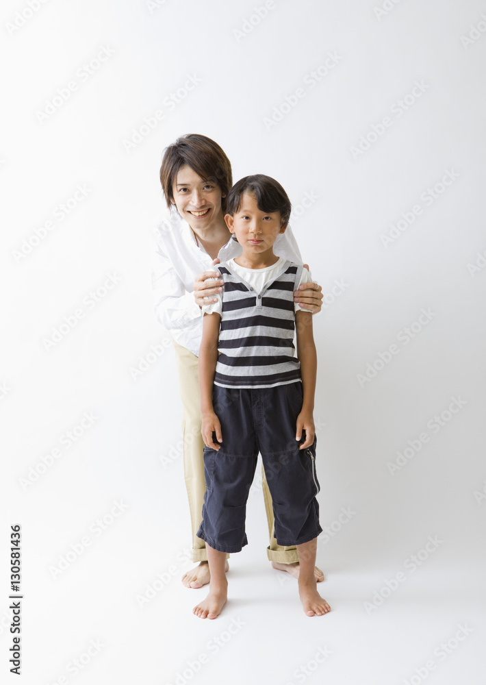Father and son standing close together Father and son standing close together