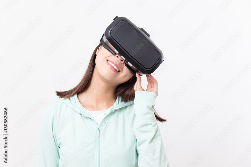 Woman looking though VR device Woman looking though VR device