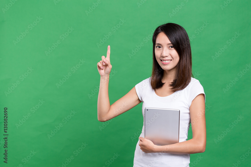 Woman holding tablet computer and finger point up Woman holding tablet computer and finger point up
