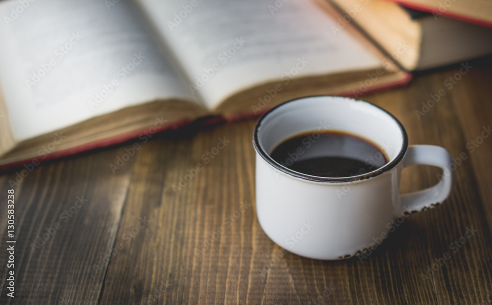 coffee in old cup on wooden with the book in vintage tone coffee in old cup on wooden with the book in vintage tone