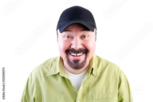 Portrait of grinning man in baseball cap