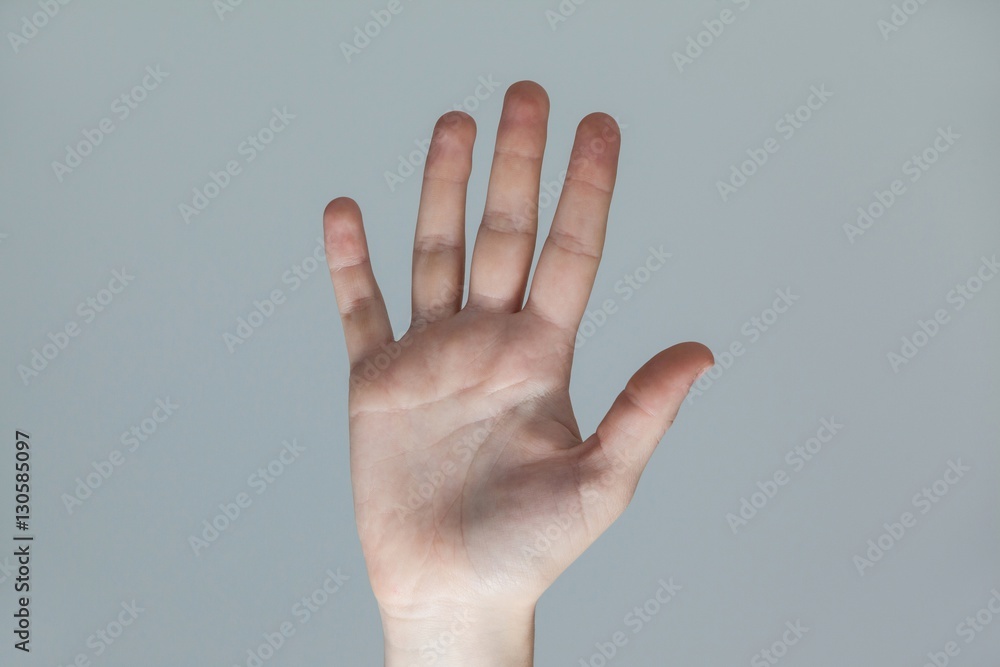 Hand of a woman touching an invisible screen Hand of a woman touching an invisible screen
