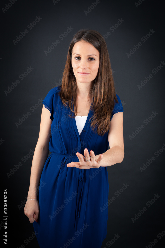 Beautiful woman doing different expressions in different sets of clothes: stop sign Beautiful woman doing different expressions in different sets of clothes: stop sign