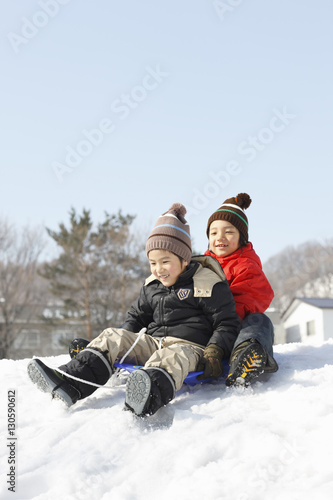 Children at play sledding