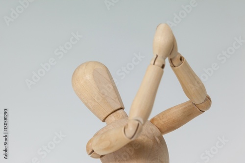 Wooden figurine with both hands joined