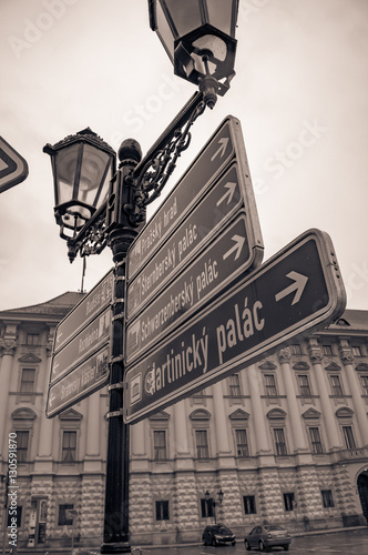 signpost navigation Prague street sign and streetlight architecture in center old town photo