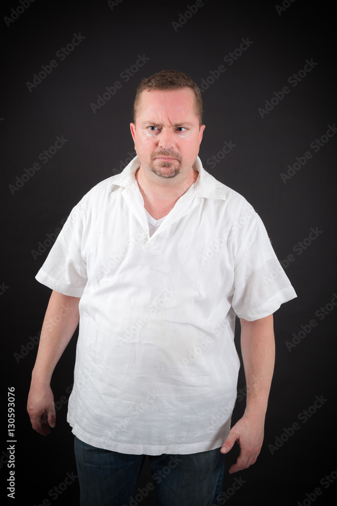 Handsome man doing different expressions in different sets of clothes: angry Handsome man doing different expressions in different sets of clothes: angry