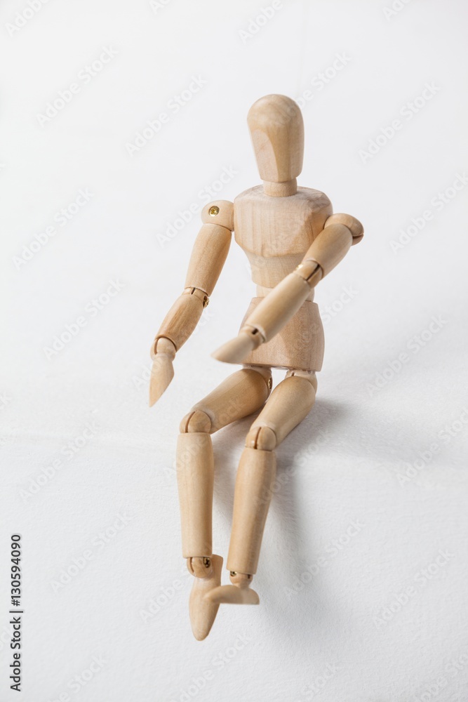 Wooden figurine sitting with his hands forward Wooden figurine sitting with his hands forward