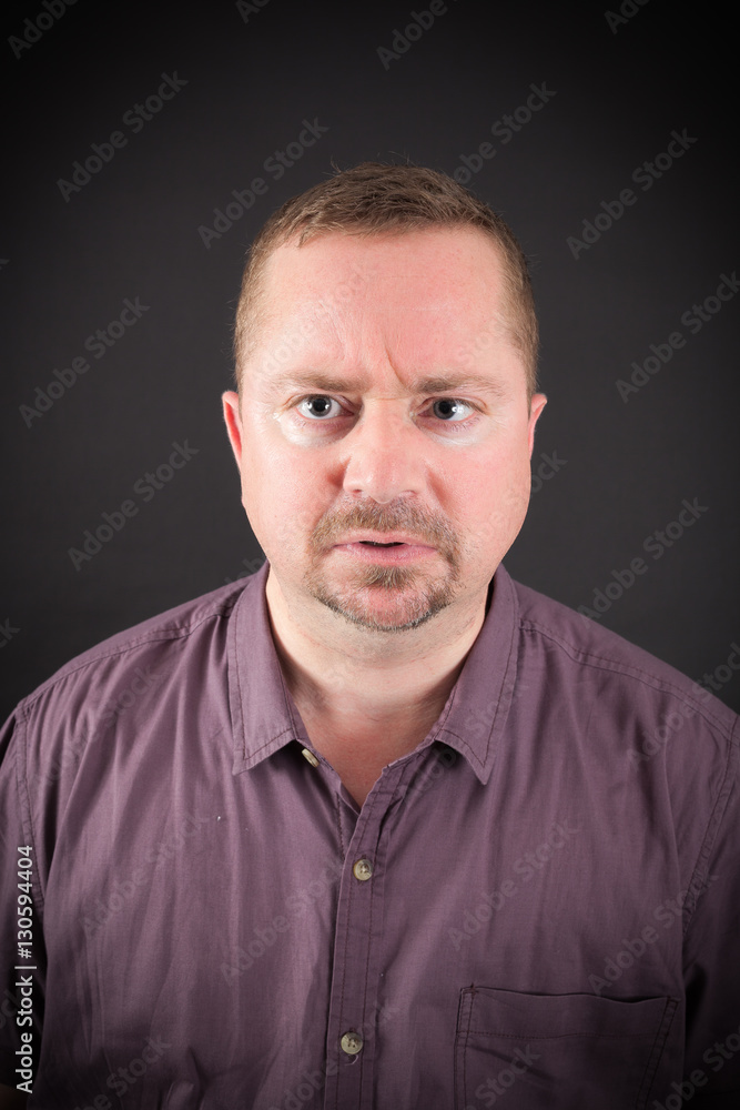 Handsome man doing different expressions in different sets of clothes: angry Handsome man doing different expressions in different sets of clothes: angry