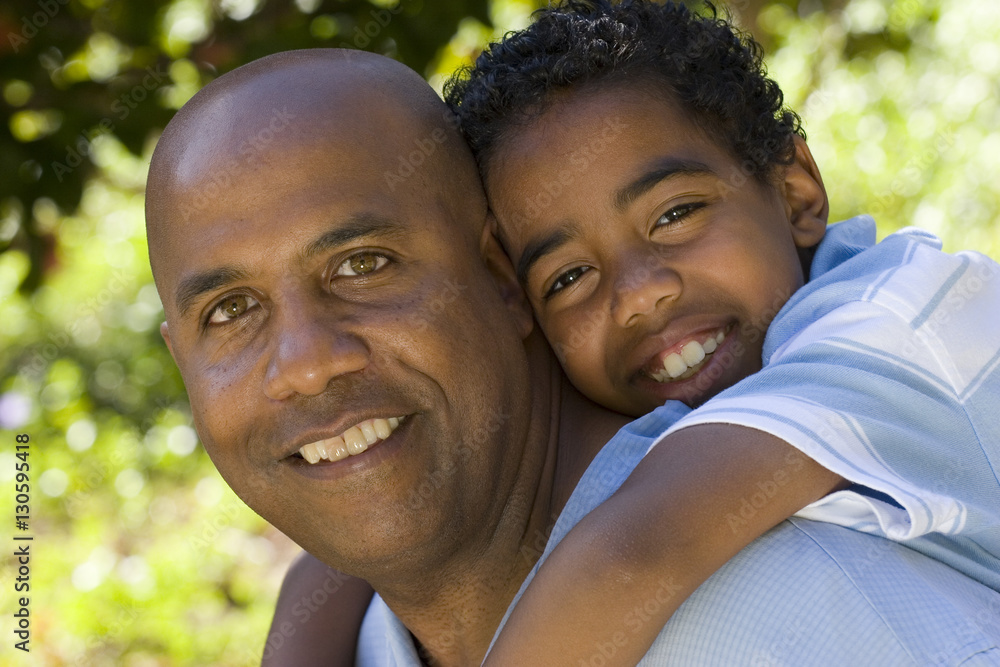 African American father and son spending time together. African American father and son spending time together.