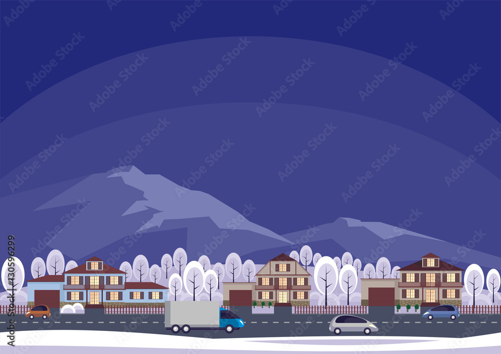 The cottage settlement against the background of mountains. Winter landscape