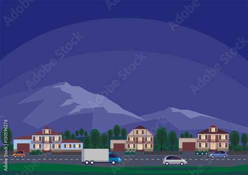 The cottage settlement against the background of mountains. Summer landscape