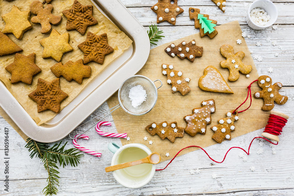 Fototapeta premium Homemade Christmas gingerbread cookies on wooden rustic background. 