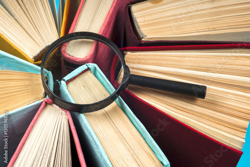 Top view of bright colorful hardback books in a circle.