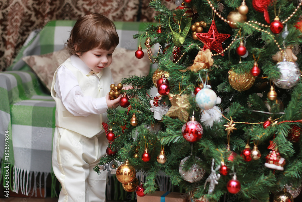child decorate the Christmas tree toy child decorate the Christmas tree toy