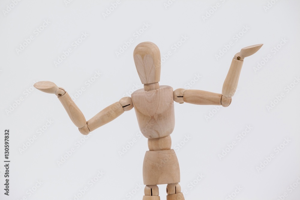 Wooden figurine standing with arms spread Wooden figurine standing with arms spread