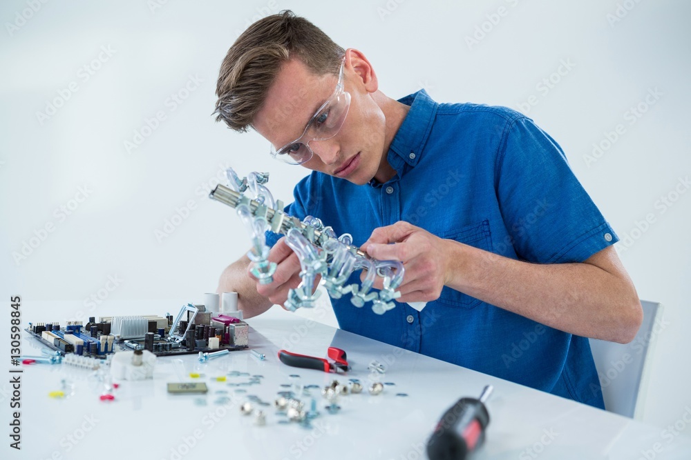 Computer engineer repairing computer motherboard Computer engineer repairing computer motherboard