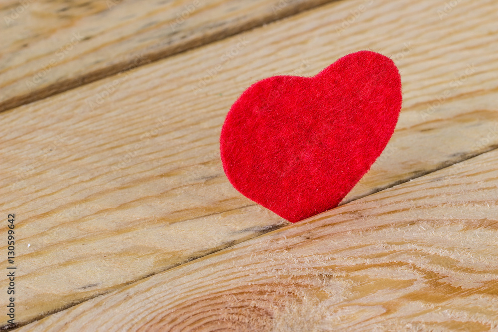 Valentines Day. Red heart on a wooden table Valentines Day. Red heart on a wooden table