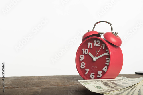 Clocks, coins and American currency. Time is money concept