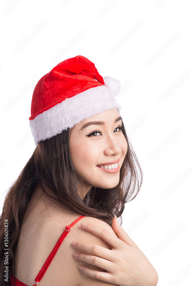 Christmas Woman. Beauty Asian Model Girl in Santa Hat isolated o Christmas Woman. Beauty Asian Model Girl in Santa Hat isolated o
