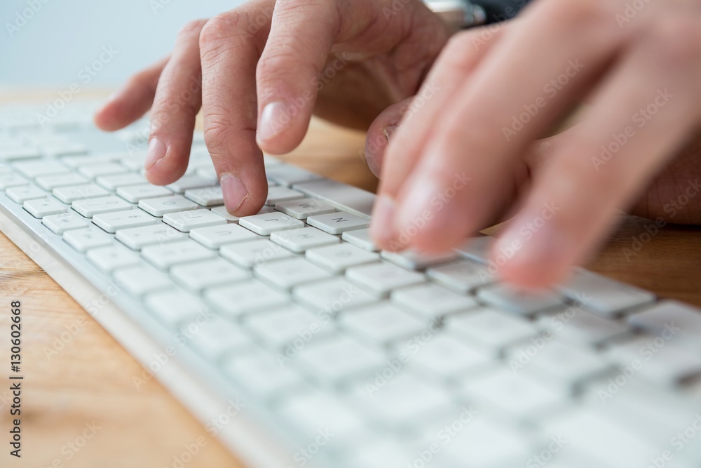 Businessman typing on keyboard Businessman typing on keyboard