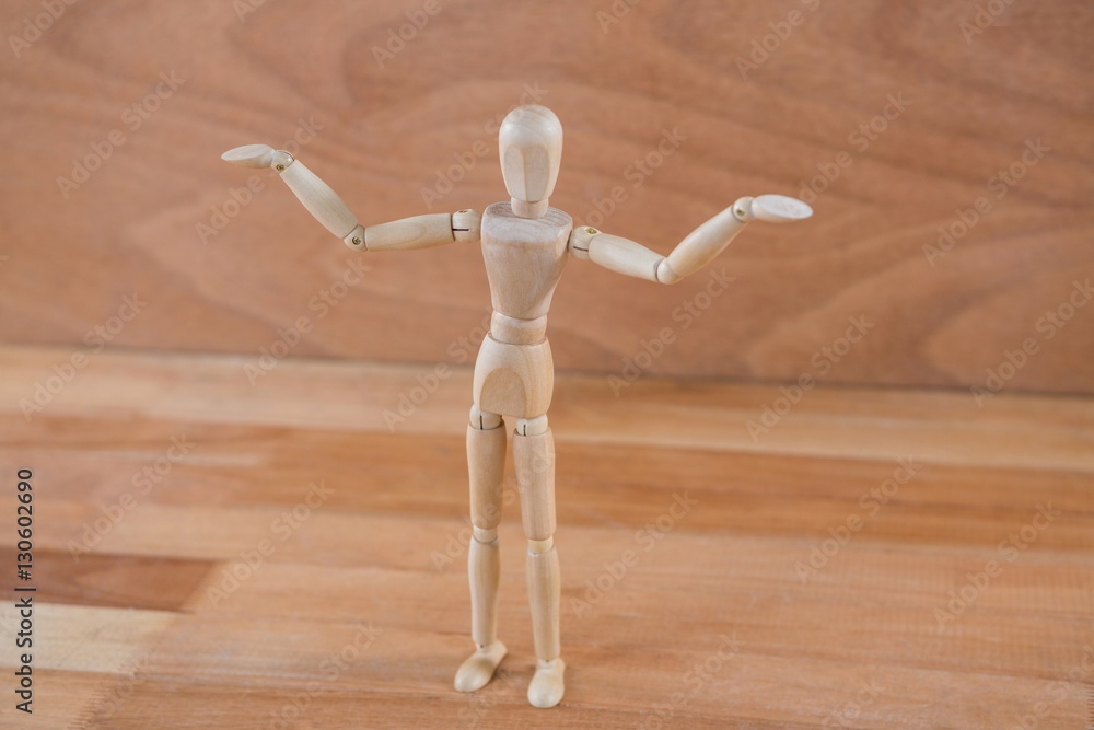 Wooden figurine standing with arms spread Wooden figurine standing with arms spread
