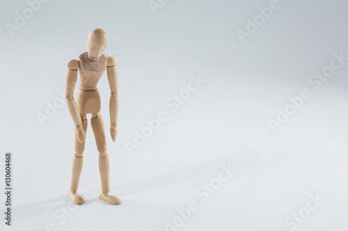 Wooden figurine on white background