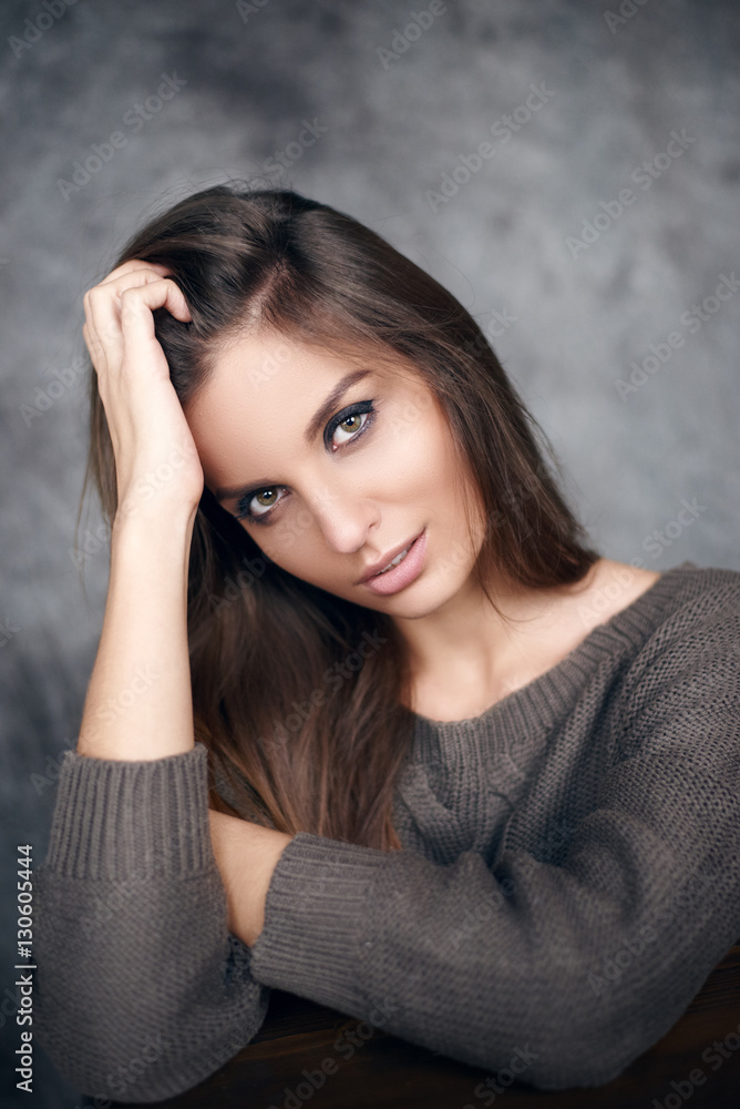 Portrait of a beautiful young and sexy girl in a sweater Portrait of a beautiful young and sexy girl in a sweater