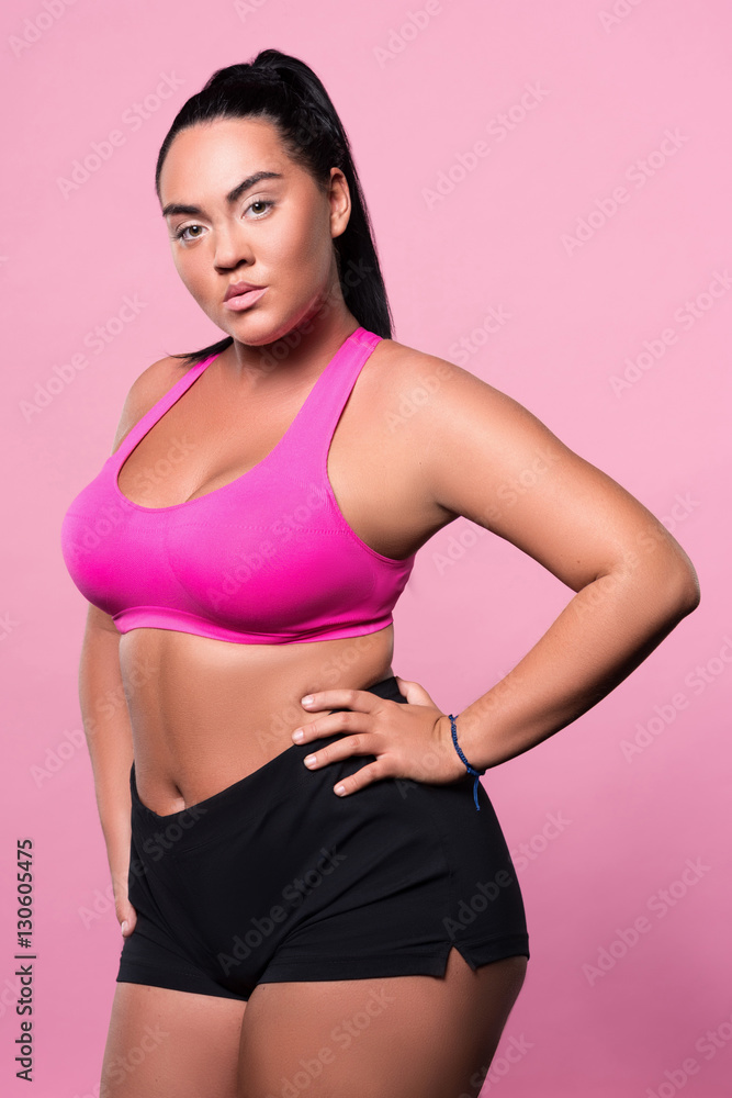 Plump girls posing against isolated background Plump girls posing against isolated background
