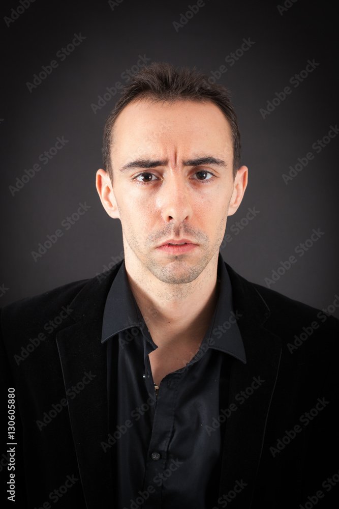 Handsome man doing different expressions in different sets of clothes: sad Handsome man doing different expressions in different sets of clothes: sad