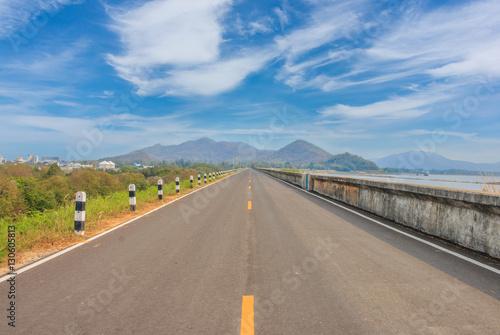 roadway for transportation with mountain and green grass, transp