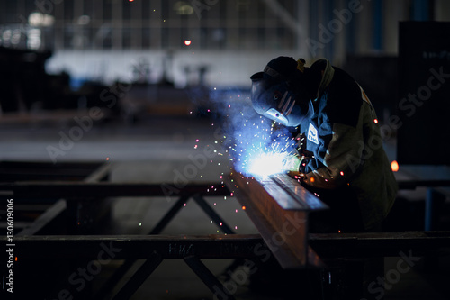 A welder at a factory