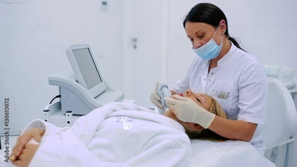 Beautician makes lifting skin procedures in clinic Beautician makes lifting skin procedures in clinic