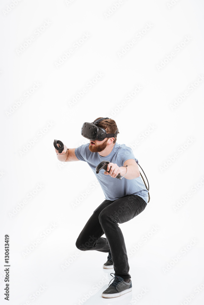 Handsome young bearded man wearing virtual reality device Handsome young bearded man wearing virtual reality device
