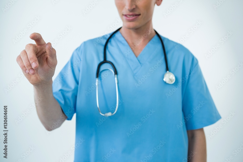 Male nurse touching an invisible screen