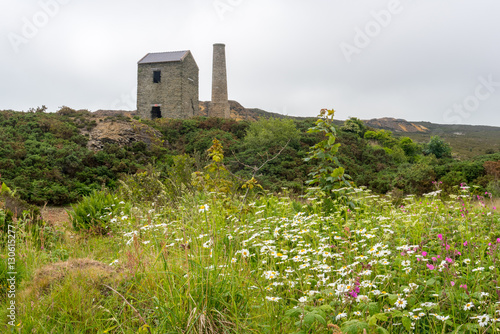 The Old engine house with chimney which used to house a steam driven pump to bring water to the copper mines. Located in Amlwch, Anglesey, Wales. Photo taken on: June 15th, 2016 