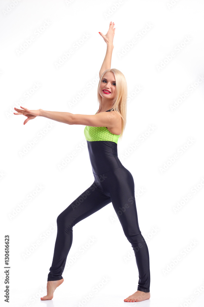 Attractive female gymnast exercising at studio Attractive female gymnast exercising at studio
