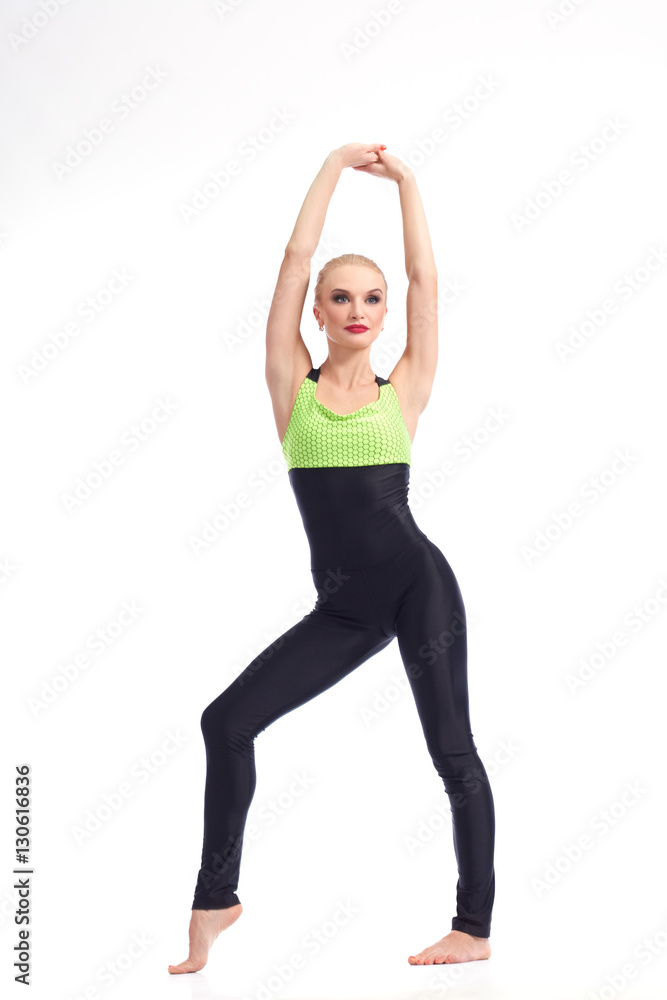 Attractive female gymnast exercising at studio Attractive female gymnast exercising at studio