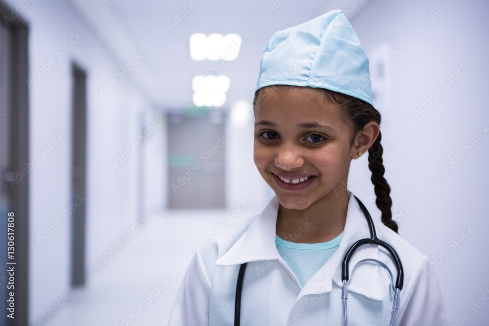 Portrait of smiling girl pretending to be a doctor Portrait of smiling girl pretending to be a doctor