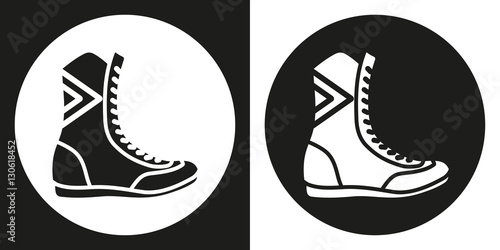 Boxing boots icon. Silhouette boxing shoes on a black and white background. Sports Equipment. Vector Illustration.