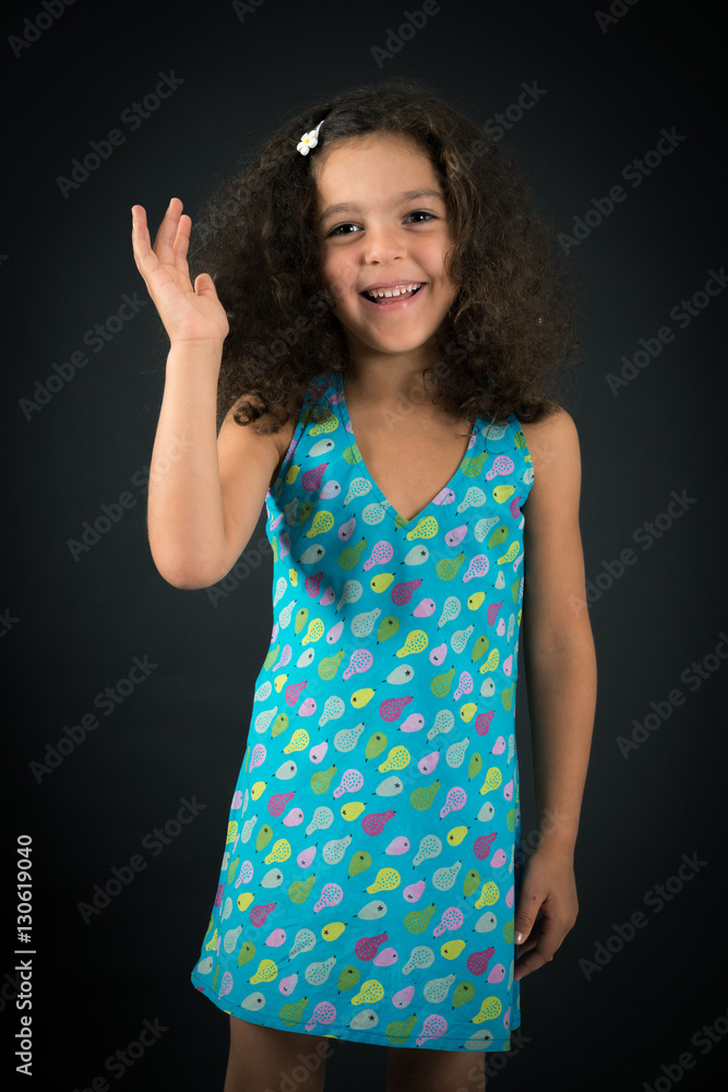 Fototapeta premium Beautiful girl doing different expressions in different sets of clothes: be careful